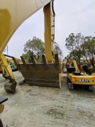 2023 Caterpillar 323DL crawler excavator side view