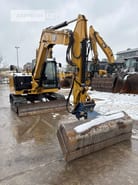 2021 Caterpillar 308-07A mini excavator, front three-quarter view 2021 Caterpillar 308-07A mini excavator, front three-quarter view