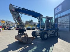 2015 Caterpillar M313D wheel excavator, side profile view