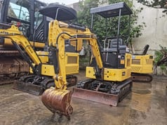 2012 Komatsu PC15MR mini excavator, front three-quarter view 2012 Komatsu PC15MR mini excavator, front three-quarter view