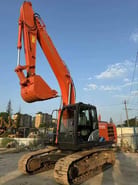 Hitachi ZX210 crawler excavator, side view