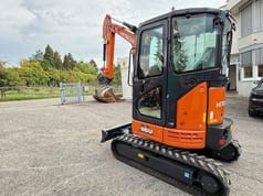 2025 Hitachi Zaxis 26U mini excavator, rear three-quarter view