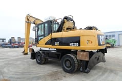 2008 Caterpillar M322D material handler, rear three-quarter view