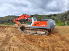 2002 O&K RH 12.5 crawler excavator, rear three-quarter view 2002 O&K RH 12.5 crawler excavator, rear three-quarter view