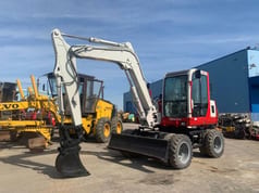 1997 Takeuchi TB070W wheel excavator, front three-quarter view
