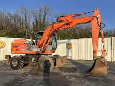2004 Kobelco E145W wheel excavator, side profile view 2004 Kobelco E145W wheel excavator, side profile view