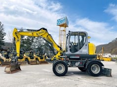 2017 Wacker Neuson EW100 wheel excavator side view 2017 Wacker Neuson EW100 wheel excavator side view