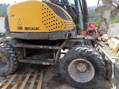 2013 Mecalac 714 MW wheel excavator side view
