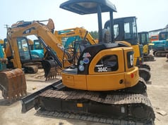 2023 Caterpillar 304CCR mini excavator, rear three-quarter view