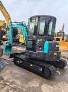 2022 Kobelco SK55SR mini excavator, rear three-quarter view 2022 Kobelco SK55SR mini excavator, rear three-quarter view