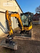 2023 Caterpillar 302.7CR mini excavator, front three-quarter view
