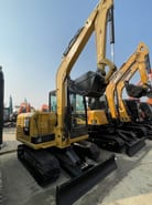 2024 Caterpillar 305.5E2 mini excavator, rear three-quarter view