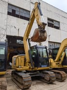 2024 Caterpillar 307E excavator, front three-quarter view