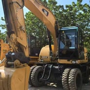 2019 Caterpillar M315D2 wheel excavator, front three-quarter view 2019 Caterpillar M315D2 wheel excavator, front three-quarter view