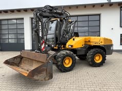 2010 Mecalac 12MTX wheel excavator, front three-quarter view 2010 Mecalac 12MTX wheel excavator, front three-quarter view