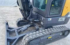 2020 Volvo EC27D mini excavator, close-up of front blade and tracks