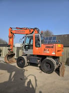 2006 Hitachi Zaxis 130W wheel excavator, side profile view