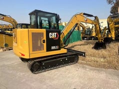 2026 Caterpillar 305.5 mini excavator, rear three-quarter view 2026 Caterpillar 305.5 mini excavator, rear three-quarter view