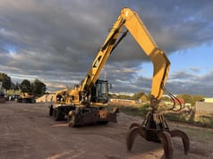 2012 Caterpillar M318 MH material handler, front three-quarter view