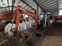 2002 Kubota KX101-3 mini excavator, front three-quarter view