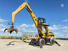 2010 Caterpillar M325D MH wheel excavator side view