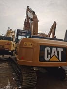 2016 Caterpillar 323DL crawler excavator, rear three-quarter view