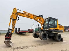 2008 Hyundai R140W-7A wheel excavator, side profile view 2008 Hyundai R140W-7A wheel excavator, side profile view