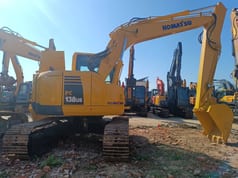 2023 Komatsu PC138US crawler excavator, rear three-quarter view