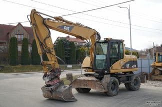 2003 Caterpillar M313C Excavator pe Roți