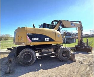 2009 Caterpillar M318D Excavadora sobre ruedas