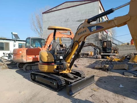 2022 Caterpillar 303CR mini excavator, rear three-quarter view 2022 Caterpillar 303CR mini excavator, rear three-quarter view