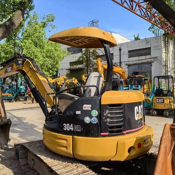 2023 Caterpillar 304CR mini excavator, rear three-quarter view 2023 Caterpillar 304CR mini excavator, rear three-quarter view