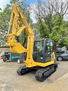 2022 Komatsu PC56-7 mini excavator, front three-quarter view 2022 Komatsu PC56-7 mini excavator, front three-quarter view