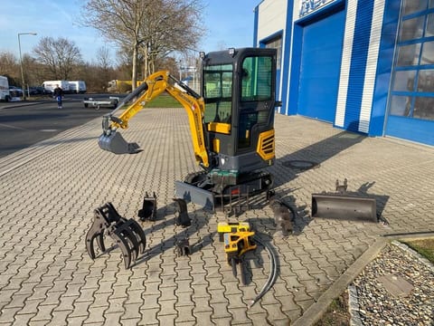 Berger Kraus BK950KS mini excavator with attachments, front three-quarter view Berger Kraus BK950KS mini excavator with attachments, front three-quarter view