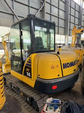 2023 Komatsu PC58 mini excavator, rear three-quarter view 2023 Komatsu PC58 mini excavator, rear three-quarter view