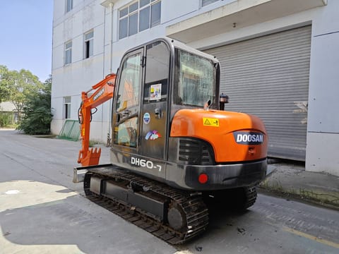 Doosan DH60-7 mini excavator, rear three-quarter view Doosan DH60-7 mini excavator, rear three-quarter view