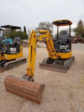 2022 Komatsu PC24MR-5 mini excavator, front three-quarter view 2022 Komatsu PC24MR-5 mini excavator, front three-quarter view
