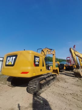 2022 Caterpillar 320GC crawler excavator, rear three-quarter view 2022 Caterpillar 320GC crawler excavator, rear three-quarter view