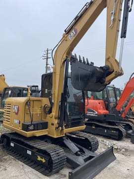 2023 Caterpillar 306E2 mini excavator, rear three-quarter view 2023 Caterpillar 306E2 mini excavator, rear three-quarter view