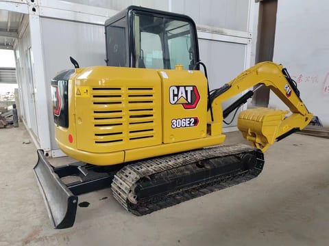 2022 Caterpillar 306E2 mini excavator, rear three-quarter view 2022 Caterpillar 306E2 mini excavator, rear three-quarter view