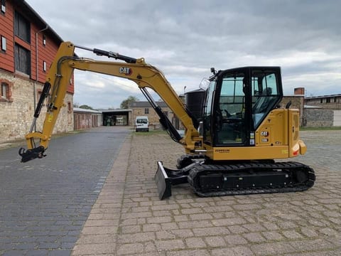 Caterpillar 306CR-07A mini excavator side view Caterpillar 306CR-07A mini excavator side view