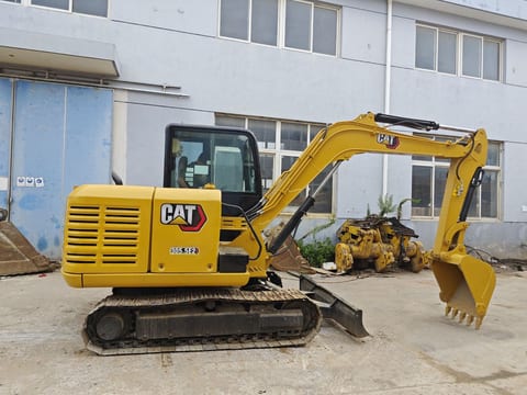 Caterpillar 305.5E2 mini excavator, side view Caterpillar 305.5E2 mini excavator, side view