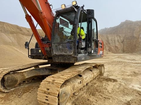 2019 Hitachi ZX250LCN-6 crawler excavator, side view of cab and tracks 2019 Hitachi ZX250LCN-6 crawler excavator, side view of cab and tracks