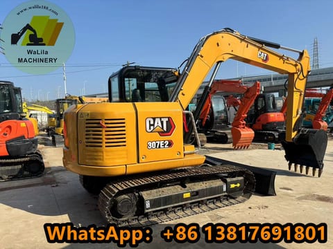 2022 Caterpillar 307E2 mini excavator, rear three-quarter view 2022 Caterpillar 307E2 mini excavator, rear three-quarter view