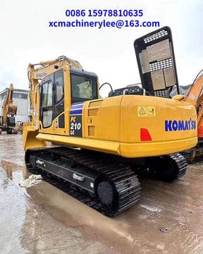 2023 Komatsu PC210LC crawler excavator, rear three-quarter view 2023 Komatsu PC210LC crawler excavator, rear three-quarter view