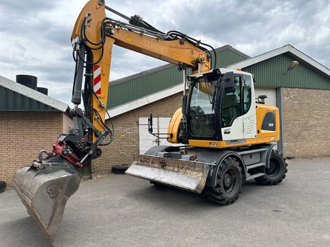 2018 Liebherr A914 wheel excavator, front three-quarter view 2018 Liebherr A914 wheel excavator, front three-quarter view