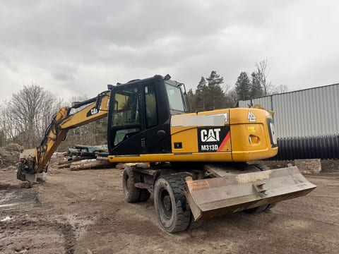 2011 Caterpillar M313D wheel excavator, rear three-quarter view 2011 Caterpillar M313D wheel excavator, rear three-quarter view