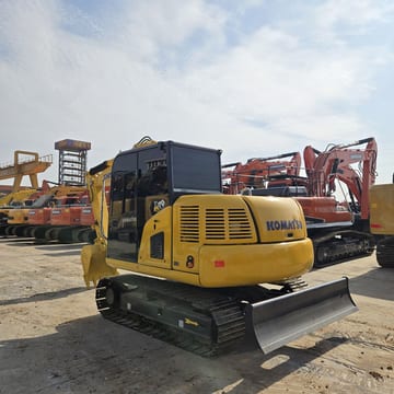Komatsu PC70-8 mini excavator, rear three-quarter view Komatsu PC70-8 mini excavator, rear three-quarter view