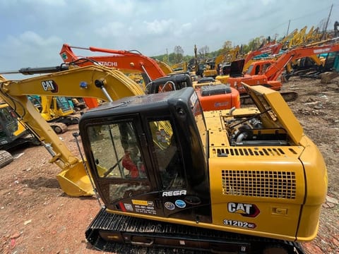 2024 Caterpillar 312D2 GC crawler excavator, rear three-quarter view 2024 Caterpillar 312D2 GC crawler excavator, rear three-quarter view