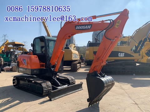 2023 MAN DX60 mini excavator, side view 2023 MAN DX60 mini excavator, side view